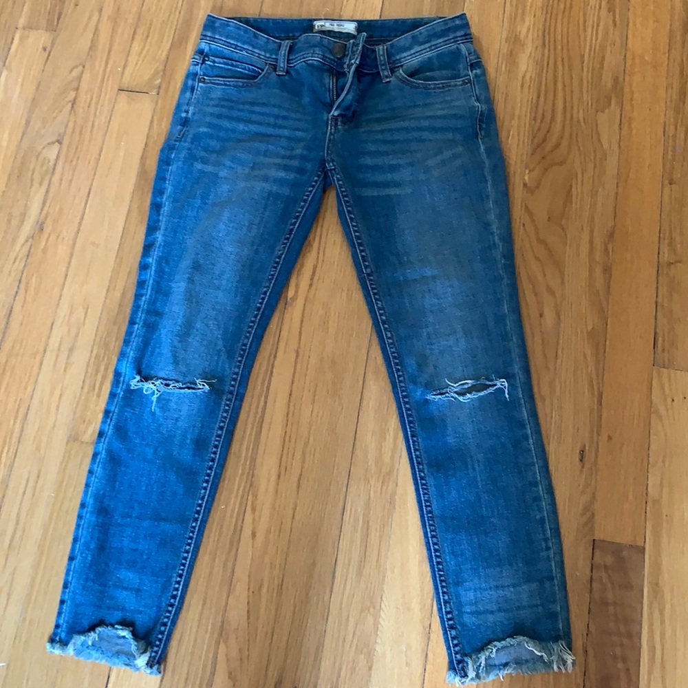 Free people low rise distressed crop jeans.